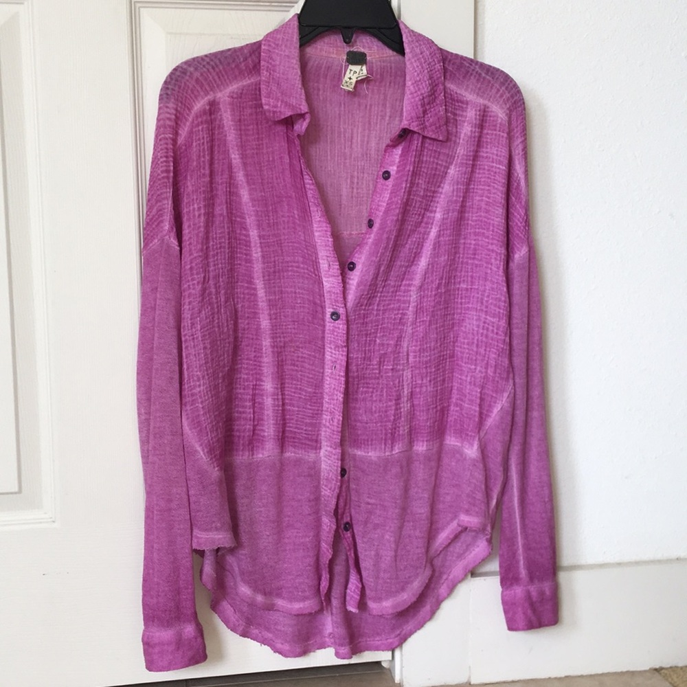 A pink long sleeve button down